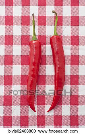 Two red chili peppers View Large Photo Image Stock Image - Two red chili peppers. Fotosearch