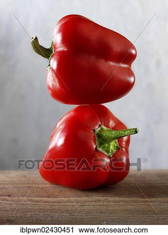 Two red peppers on each other View Large Photo Image Stock Image - Two red peppers on each other. Fotosearch