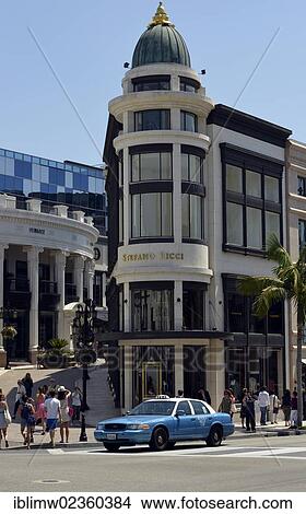 "Two Rodeo Drive, Stefano Ricci store, taxi, Rodeo Drive luxury shopping street, Beverly Hills, Los Angeles, California, United States of America, USA, PublicGround" View Large Photo Image Picture - "Two Rodeo Drive, Stefano Ricci store, taxi, Rodeo Drive luxury shopping street, Beverly Hills, Los Angeles, California, United States of America, USA, PublicGround". Fotosearch