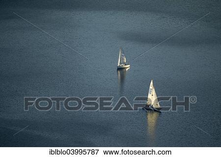 "Two sailboats on lake Henne, calm, Meschede, Sauerland, North Rhine-Westphalia, Germany, Europe" View Large Photo Image Stock Photo - "Two sailboats on lake Henne, calm, Meschede, Sauerland, North Rhine-Westphalia, Germany, Europe". Fotosearch
