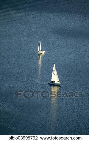 "Two sailboats on the Henne, calm, Meschede, Sauerland, North Rhine-Westphalia, Germany, Europe" View Large Photo Image Stock Image - "Two sailboats on the Henne, calm, Meschede, Sauerland, North Rhine-Westphalia, Germany, Europe". Fotosearch
