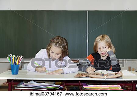 "Two schoolgirls, 7 and 9 years, at school" View Large Photo Image Stock Photo - "Two schoolgirls, 7 and 9 years, at school". Fotosearch