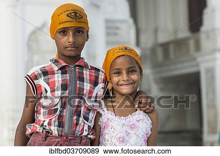 "Two Sikh children at the Harmandir Sahib or Golden Temple, a holy Sikh temple, Amritsar, Punjab, India, Asia" View Large Photo Image Stock Photo - "Two Sikh children at the Harmandir Sahib or Golden Temple, a holy Sikh temple, Amritsar, Punjab, India, Asia". Fotosearch