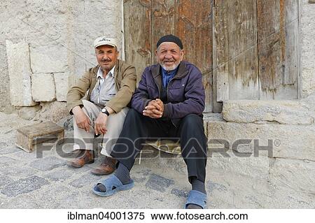 "Two sitting men, Urgup, Nevsehir Province, Cappadocia, Central Anatolia Region, Anatolia, Turkey, Asia" View Large Photo Image Stock Photography - "Two sitting men, Urgup, Nevsehir Province, Cappadocia, Central Anatolia Region, Anatolia, Turkey, Asia". Fotosearch