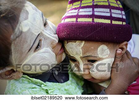 "Two small children with thanaka paste on their faces kissing, Bagan, Myanmar, Burma, Southeast Asia, Asia" View Large Photo Image Stock Image - "Two small children with thanaka paste on their faces kissing, Bagan, Myanmar, Burma, Southeast Asia, Asia". Fotosearch