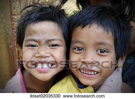 "Two smiling children in Cambodia, Southeast Asia, Asia" View Large Photo Image Stock Image - "Two smiling children in Cambodia, Southeast Asia, Asia". Fotosearch