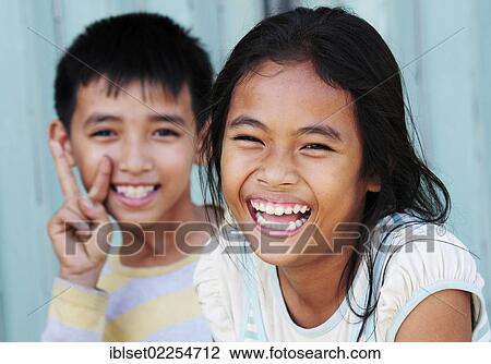 "Two smiling children, portrait, Cambodia, Southeast Asia, Asia" View Large Photo Image Stock Image - "Two smiling children, portrait, Cambodia, Southeast Asia, Asia". Fotosearch