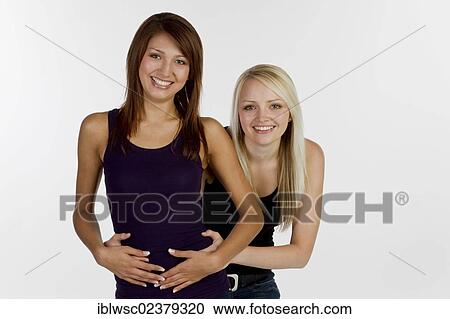 Two smiling young women View Large Photo Image Stock Image - Two smiling young women. Fotosearch