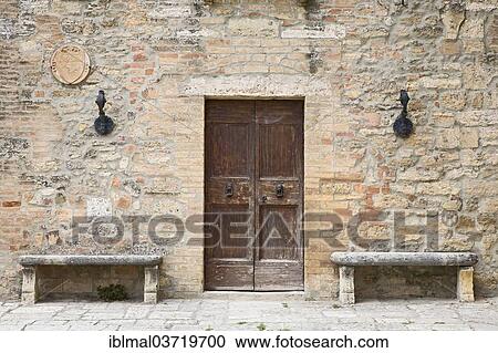 "Two stone benches standing next to the door of an old house, Lucignano d'Asso, Tuscany, Italy, Europe" View Large Photo Image Stock Image - "Two stone benches standing next to the door of an old house, Lucignano d'Asso, Tuscany, Italy, Europe". Fotosearch