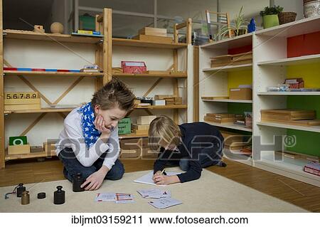 "Two students at an independant school, working with the materials, Aktive Schule Peterhausen, Petershausen, Upper Bavaria, Bavaria, Germany, Europe" View Large Photo Image Stock Image - "Two students at an independant school, working with the materials, Aktive Schule Peterhausen, Petershausen, Upper Bavaria, Bavaria, Germany, Europe". Fotosearch