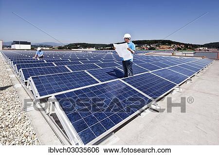 "Two technicians inspecting a solar energy plant, Wollsdorf, Weiz District, Styria, Austria, Europe" View Large Photo Image Stock Photograph - "Two technicians inspecting a solar energy plant, Wollsdorf, Weiz District, Styria, Austria, Europe". Fotosearch
