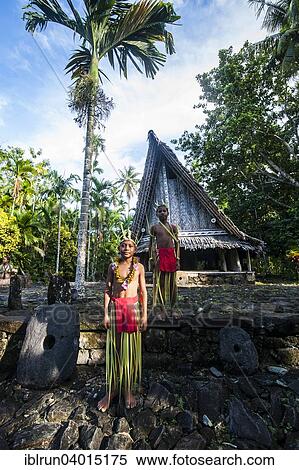 "Two traditionally dressed boys standing in front of a traditional hut, Yap Island, Caroline Islands, Micronesia, Oceania" View Large Photo Image Stock Photography - "Two traditionally dressed boys standing in front of a traditional hut, Yap Island, Caroline Islands, Micronesia, Oceania". Fotosearch