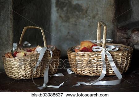 Two wicker baskets with rose petals View Large Photo Image Stock Photo - Two wicker baskets with rose petals. Fotosearch