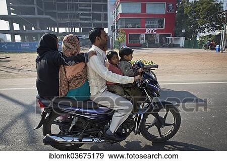 "Two women, one man and two children riding together on a motorcycle, Agra, Uttar Pradesh, India, Asia" View Large Photo Image Stock Photo - "Two women, one man and two children riding together on a motorcycle, Agra, Uttar Pradesh, India, Asia". Fotosearch