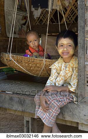 "Two young brothers in front of their house in a small village, Bagan, Bagan, Mandalay, Myanmar, Burma, Asia" View Large Photo Image Stock Photograph - "Two young brothers in front of their house in a small village, Bagan, Bagan, Mandalay, Myanmar, Burma, Asia". Fotosearch