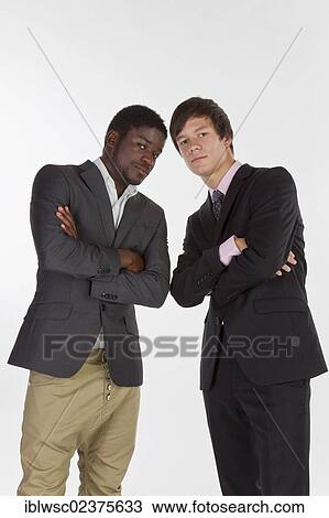 Stock Image - Two young men with different skin colors. Fotosearch