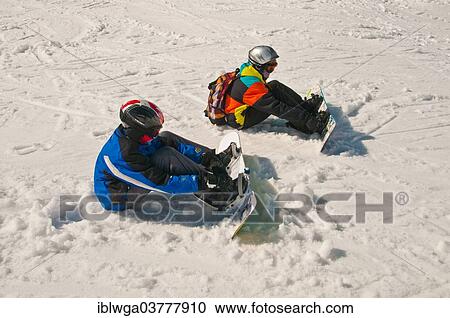 "Two young snowboarders are preparing for a ski-run, Mt Nebelhorn, Oberstdorf, Allgau Alps, Upper Allgau, Bavaria, Germany, Europe" View Large Photo Image Stock Image - "Two young snowboarders are preparing for a ski-run, Mt Nebelhorn, Oberstdorf, Allgau Alps, Upper Allgau, Bavaria, Germany, Europe". Fotosearch