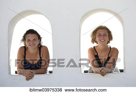 "Two young women looking out from the Balcon de Femes, Femes, Lanzarote, Canary Islands, Spain, Europe" View Large Photo Image Stock Photo - "Two young women looking out from the Balcon de Femes, Femes, Lanzarote, Canary Islands, Spain, Europe". Fotosearch