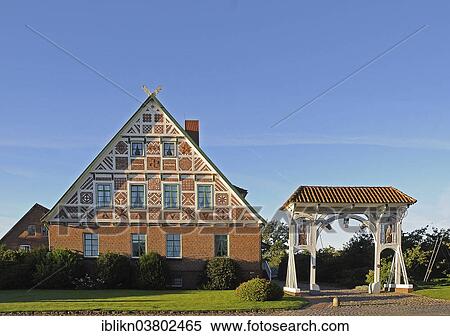 Stock Photography - "Typical Altlander half-timbered house with a magnificent gate, Jork, Altes Land, Lower Saxony, Germany, Europe". Fotosearch