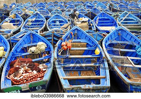 "Typical blue fishing boats in the harbor of Essaouira, Morocco, Africa" View Large Photo Image Stock Photo - "Typical blue fishing boats in the harbor of Essaouira, Morocco, Africa". Fotosearch