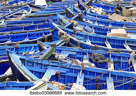 "Typical blue fishing boats in the harbor of Essaouira, Morocco, Africa" View Large Photo Image Stock Photo - "Typical blue fishing boats in the harbor of Essaouira, Morocco, Africa". Fotosearch
