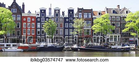 "Typical canal houses and boats along the Amstel Canal, Amsterdam, province of North Holland, The Netherlands, Europe" View Large Photo Image Stock Photo - "Typical canal houses and boats along the Amstel Canal, Amsterdam, province of North Holland, The Netherlands, Europe". Fotosearch