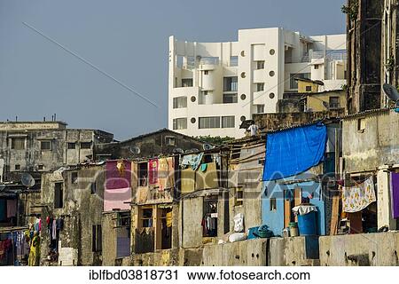 "Typical homes of poor working class Indians in front of a modern residential building, Mumbai, Maharashtra, India, Asia" View Large Photo Image Stock Image - "Typical homes of poor working class Indians in front of a modern residential building, Mumbai, Maharashtra, India, Asia". Fotosearch