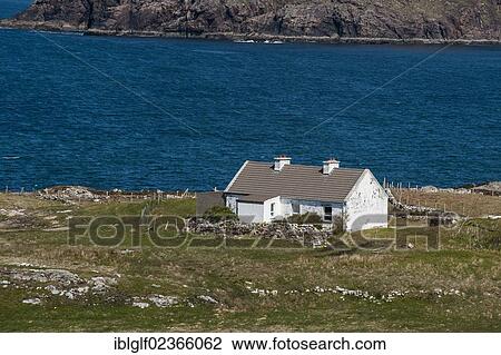 Stock Image - "Typical Irish house near the road """"Atlantic Drive"""" near Doagh, Letterkenny, County Donegal, Republic of Ireland, Europe". Fotosearch