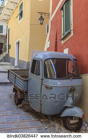 "Typical Italian three-wheeled light commercial vehicle parked in an alley, Vallebona, Liguria, Italy, Europe" View Large Photo Image Stock Photo - "Typical Italian three-wheeled light commercial vehicle parked in an alley, Vallebona, Liguria, Italy, Europe". Fotosearch