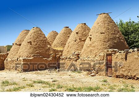 Stock Image - "Typical mud houses in the old city of Harran, southwestern Anatolia, Turkey, Asia". Fotosearch