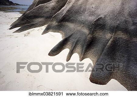 Stock Image - "Typical rock formations in the Seychelles at a sandy beach, Anse Union, La Digue, Seychelles, Africa". Fotosearch