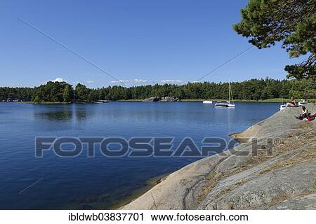 Stock Image - "Typical round polished rocks, roches moutonnees, on Finnhamn Island in the Stockholm Middle Archipelago, Stockholm, Sweden, Europe". Fotosearch
