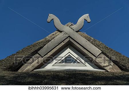 Stock Image - "Typical wooden gable of a thatched roof, Ahrenshop, Fischland, Mecklenburg-Western Pomerania, Germany, Europe". Fotosearch