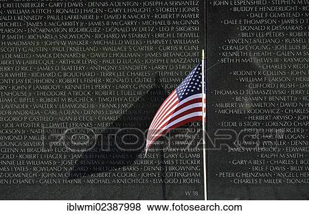 "U. S. Flag flying in front of the Vietnam Veterans Memorial Wall, national memorial with the names of the fallen U. S. soldiers in the Vietnam War, Washington DC, District of Columbia, USA" View Large Photo Image Stock Photo - "U. S. Flag flying in front of the Vietnam Veterans Memorial Wall, national memorial with the names of the fallen U. S. soldiers in the Vietnam War, Washington DC, District of Columbia, USA". Fotosearch