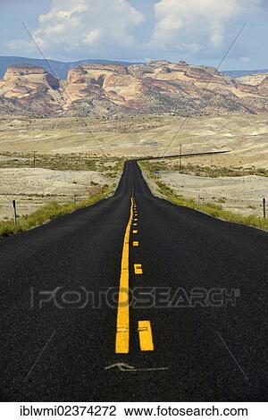 Stock Image - "U. S. Highway 24, view of the Navajo Dome Plateau, Capitol Reef National Park, Utah, Southwestern USA". Fotosearch