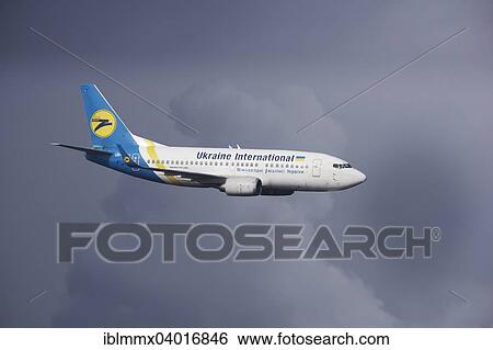 "Ukraine International Airlines, Boeing 737-500 in flight during a thunderstorm" View Large Photo Image Stock Photograph - "Ukraine International Airlines, Boeing 737-500 in flight during a thunderstorm". Fotosearch