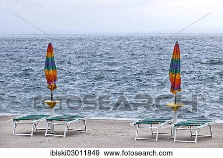 "Umbrellas and deckchairs during the preseason on the beach of Opatija on the Mediterranean Sea in Kvarner Bay, Istria, Croatia, Europe, Opatija, Croatia, Europe" View Large Photo Image Stock Photo - "Umbrellas and deckchairs during the preseason on the beach of Opatija on the Mediterranean Sea in Kvarner Bay, Istria, Croatia, Europe, Opatija, Croatia, Europe". Fotosearch