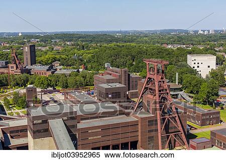 Stock Photography - "UNESCO World Heritage Site Zeche Zollverein Schacht 1 2 8, Red Dot Design Museum, Doppelbock headframe, shaft 12, Zollverein-Kubus building, Essen, North Rhine-Westphalia, Germany, Europe". Fotosearch