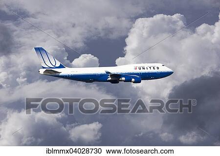 United Airlines Boeing 747-422 N104UA in flight during a thunderstorm View Large Photo Image Stock Image - United Airlines Boeing 747-422 N104UA in flight during a thunderstorm. Fotosearch