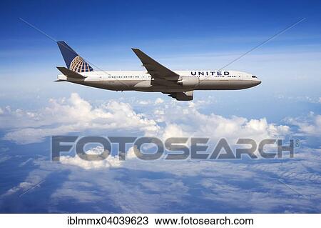 United Airlines Boeing 777 in flight View Large Photo Image Stock Image - United Airlines Boeing 777 in flight. Fotosearch