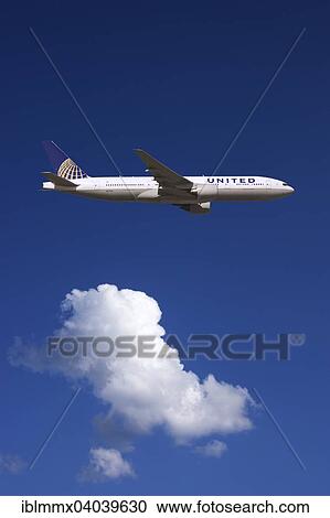 United Airlines Boeing 777 in flight View Large Photo Image Stock Image - United Airlines Boeing 777 in flight. Fotosearch