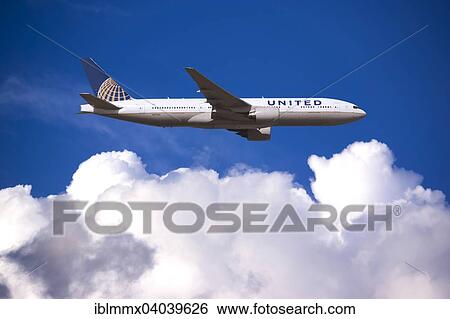 United Airlines Boeing 777 in flight View Large Photo Image Stock Photograph - United Airlines Boeing 777 in flight. Fotosearch