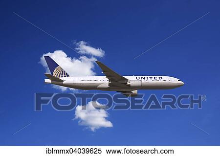 United Airlines Boeing 777 in flight View Large Photo Image Stock Photography - United Airlines Boeing 777 in flight. Fotosearch