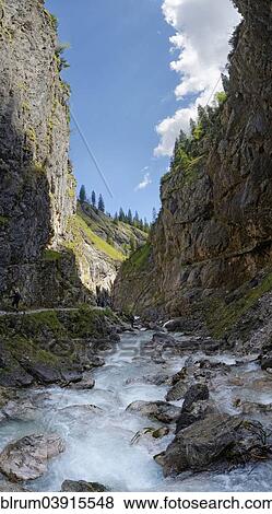 "Upper entrance of the Hollentalklamm gorge with the rushing waters of the Hammersbach stream, Hammerbach, Garmisch-Partenkirchen District, Upper Bavaria, Bavaria, Germany, Europe" View Large Photo Image Stock Photo - "Upper entrance of the Hollentalklamm gorge with the rushing waters of the Hammersbach stream, Hammerbach, Garmisch-Partenkirchen District, Upper Bavaria, Bavaria, Germany, Europe". Fotosearch