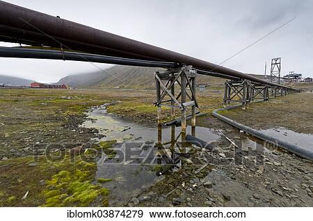 Stock Photo - "Utility pipes and supply lines installed above ground because of the permafrost, Longyearbyen, Spitsbergen, Svalbard Archipelago, Svalbard and Jan Mayen, Norway, Europe". Fotosearch