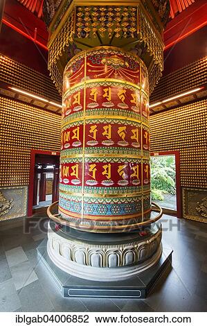 "Vairocana Buddha Prayer Wheel in the Ten Thousands Buddhas Pavilion, Buddha Tooth Relic Temple, Chinatown, Singapore, Asia" View Large Photo Image Stock Image - "Vairocana Buddha Prayer Wheel in the Ten Thousands Buddhas Pavilion, Buddha Tooth Relic Temple, Chinatown, Singapore, Asia". Fotosearch