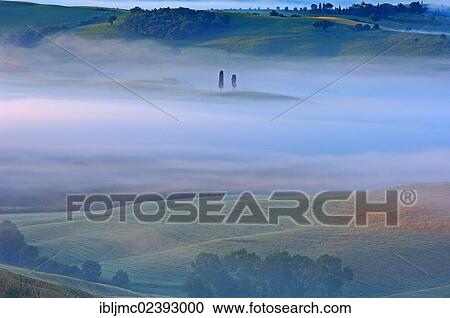 "Val d'Orcia, Orcia Valley at dawn, morning fog, UNESCO World Heritage Site, Siena Province, Tuscany, Italy, Europe" View Large Photo Image Stock Image - "Val d'Orcia, Orcia Valley at dawn, morning fog, UNESCO World Heritage Site, Siena Province, Tuscany, Italy, Europe". Fotosearch