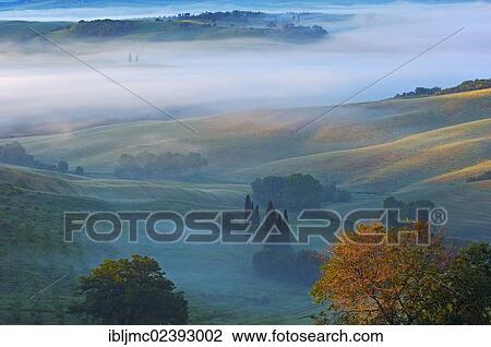 "Val d'Orcia, Orcia Valley at dawn, morning fog, UNESCO World Heritage Site, Siena Province, Tuscany, Italy, Europe" View Large Photo Image Stock Image - "Val d'Orcia, Orcia Valley at dawn, morning fog, UNESCO World Heritage Site, Siena Province, Tuscany, Italy, Europe". Fotosearch