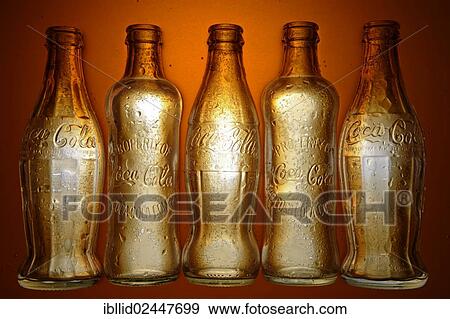 Various historic Coca-Cola bottles View Large Photo Image Stock Photo - Various historic Coca-Cola bottles. Fotosearch