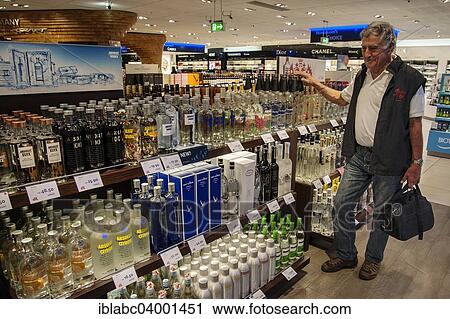 "Various spirits and a tourist in the duty-free shop, Frankfurt Airport, Frankfurt am Main, Hesse, Germany, Europe" View Large Photo Image Stock Image - "Various spirits and a tourist in the duty-free shop, Frankfurt Airport, Frankfurt am Main, Hesse, Germany, Europe". Fotosearch